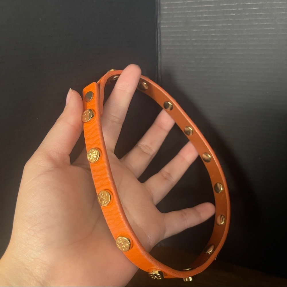 Orange Tory Burch wrap around leather bracelet